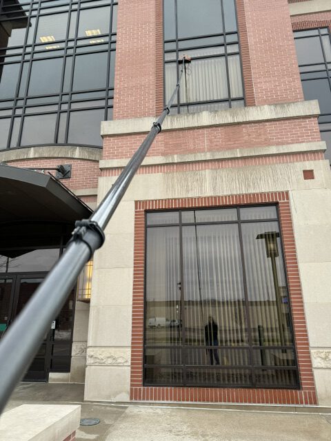 Professional window cleaning on a commercial building